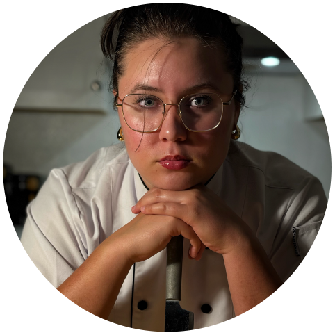 Chef Amara Hass in a white chef's coat